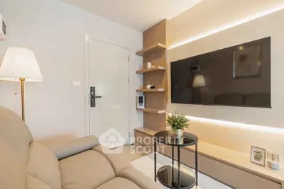 Modern living room with sleek TV setup and cozy seating area