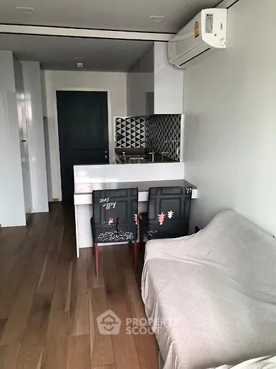 Modern compact living space with kitchenette and stylish decor