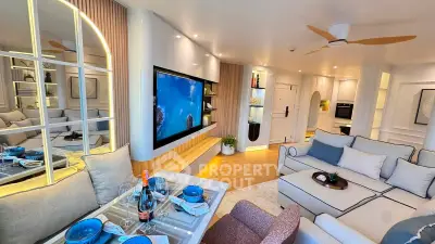 Luxurious modern living room with elegant decor, large TV, and stylish dining area, perfect for entertaining.