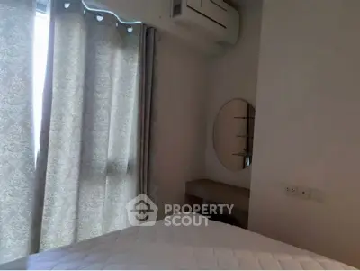 Cozy bedroom with air conditioning and elegant curtains