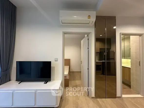 Modern apartment interior with TV, air conditioning, and sleek design