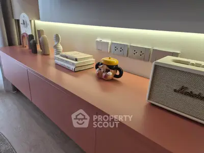 Stylish modern living room shelf with books and decor items