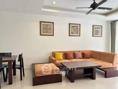 Modern living room with stylish furniture and ceiling fan