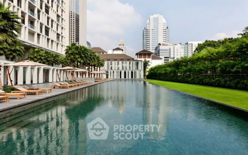 Luxurious urban poolside oasis with modern architecture and lush greenery.