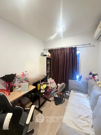 Cozy study room with modern desk and comfortable seating, perfect for productivity and relaxation.