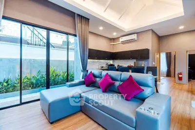 Spacious modern living room with large windows and stylish decor