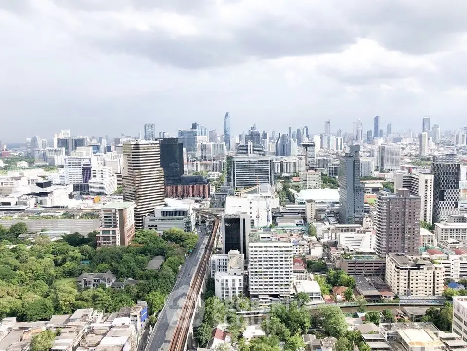 Stunning cityscape view showcasing a vibrant urban skyline with lush greenery and modern architecture.