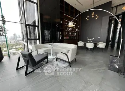 Luxurious modern living room with city view, elegant furniture, and stylish decor in high-rise building.