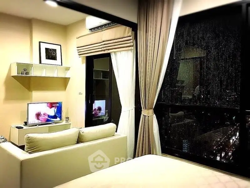 Cozy living room with modern decor and large window view