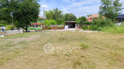 Spacious residential land plot with lush greenery and potential for development