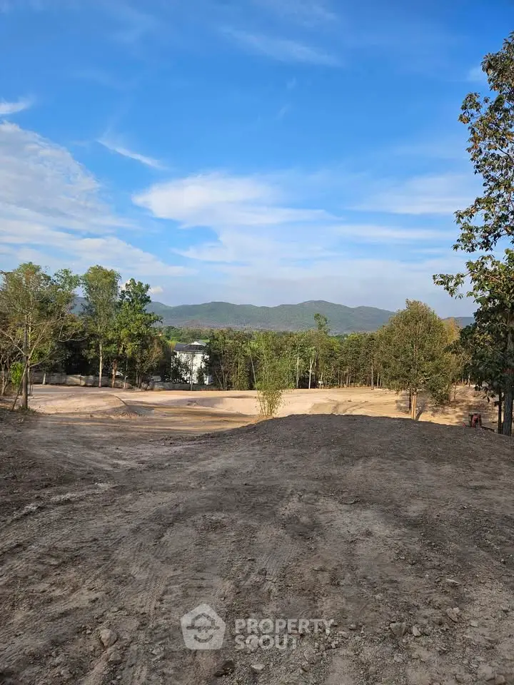 Expansive land plot with scenic mountain views, perfect for development opportunities.