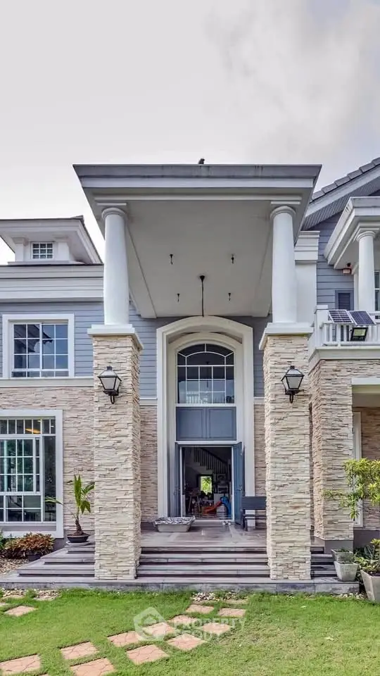 Stunning two-story home with grand entrance and elegant architectural details