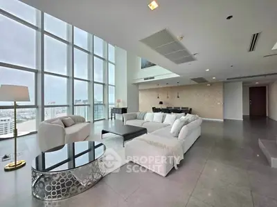Luxurious modern living room with floor-to-ceiling windows and stunning city views.