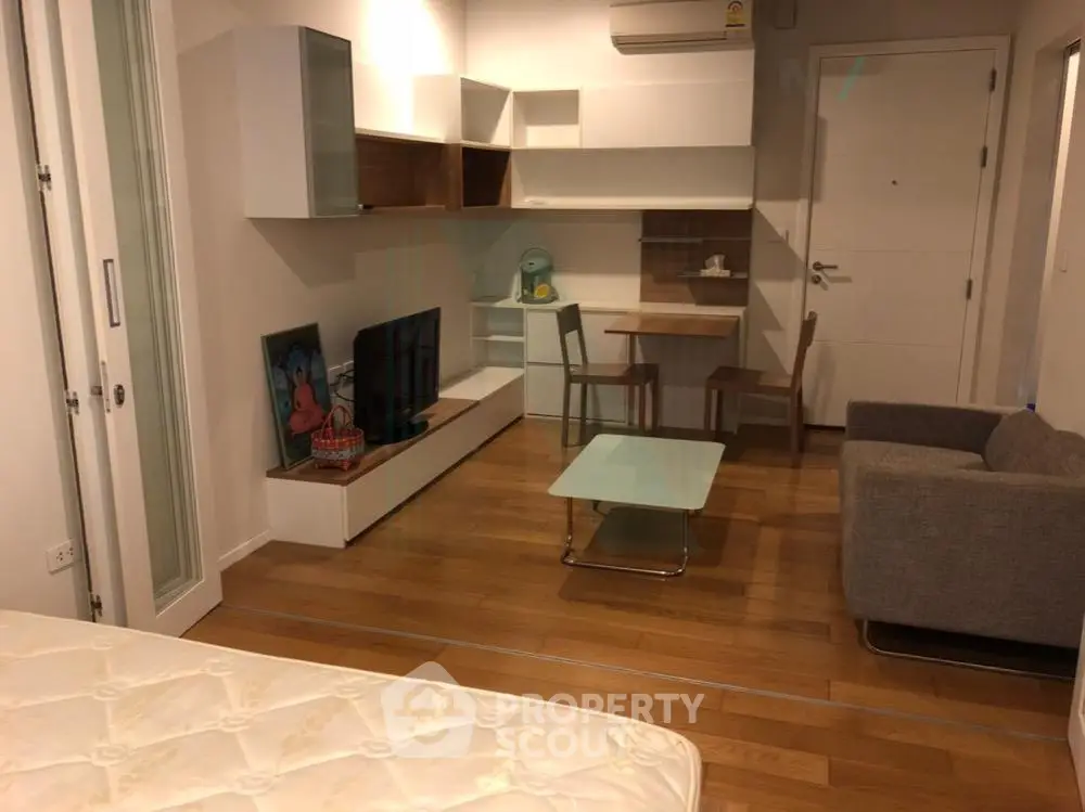 Modern studio apartment with stylish furniture and open layout in a cozy living space.