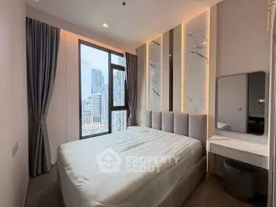 Luxurious bedroom with stunning city view and elegant decor in modern apartment.