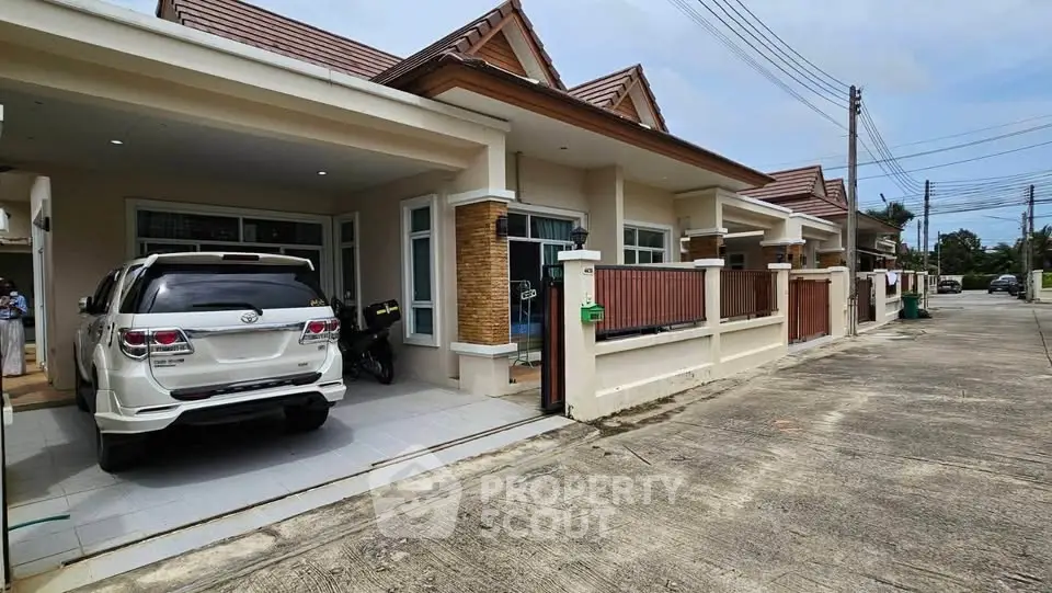 Charming suburban row houses with driveways and modern design, perfect for family living.