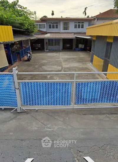 Spacious residential property with ample outdoor space and secure fencing, ideal for family living.