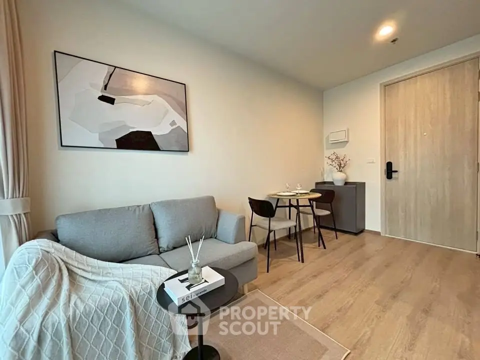 Modern living room with cozy sofa and stylish decor in a contemporary apartment.