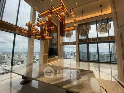 Luxurious high-rise apartment with stunning city views and modern lighting fixtures.
