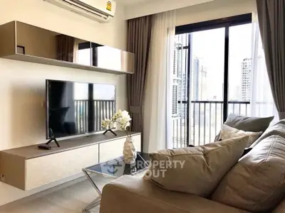 Modern living room with sleek furniture and city view balcony in a stylish apartment.
