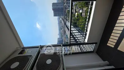 Stunning balcony view with cityscape and modern railings, perfect for urban living.