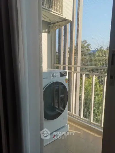 Compact balcony with washing machine and scenic view