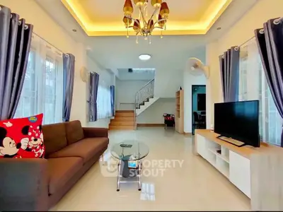 Spacious living room with modern decor and elegant lighting