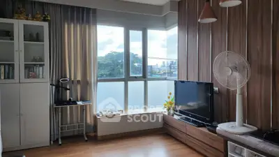Modern living room with large windows and wooden accents