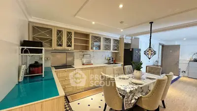 Spacious kitchen with elegant dining area and modern appliances