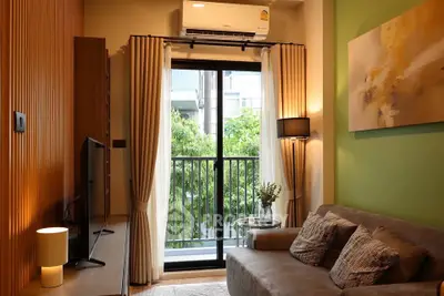 Cozy living room with balcony view, modern decor, and air conditioning.