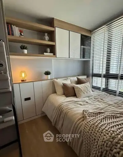 Cozy modern bedroom with stylish decor and natural light