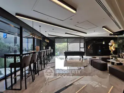 Luxurious modern living room with sleek design and pool table, perfect for entertaining.