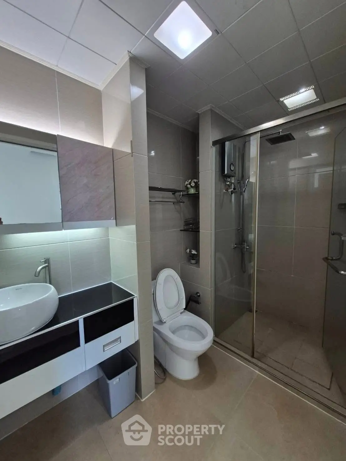 Modern bathroom with sleek fixtures and glass shower enclosure