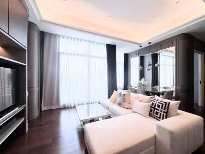 Luxurious modern living room with elegant decor and large windows