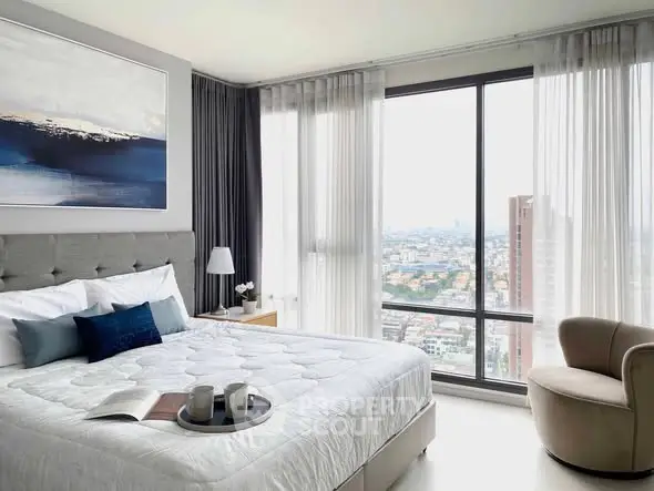 Luxurious bedroom with stunning city view and elegant decor