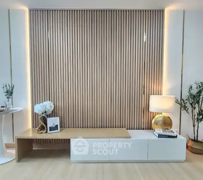 Modern living room with stylish wooden panel wall and elegant decor
