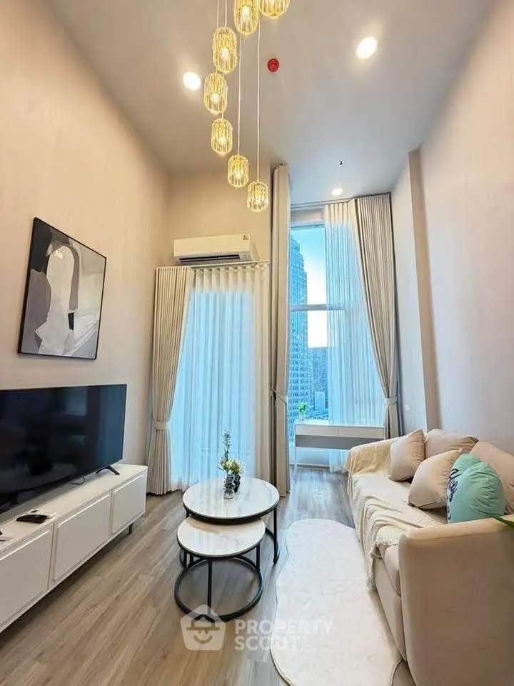 Modern living room with high ceiling, elegant lighting, and city view through large windows.