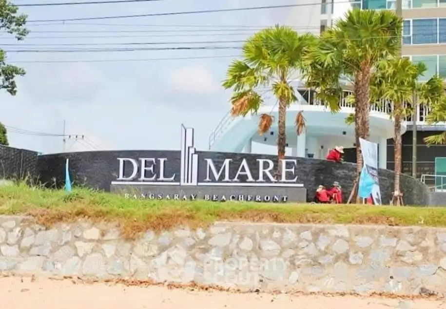 Del Mare Bangsaray Beachfront entrance with palm trees and modern architecture
