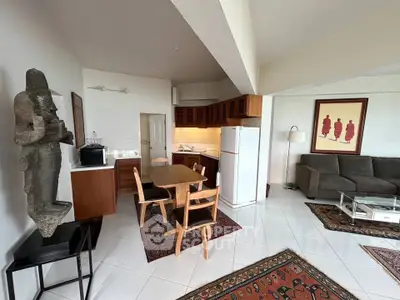 Spacious open-plan living room with modern kitchen and stylish decor
