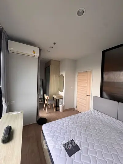 Modern bedroom with air conditioning and stylish furniture in a cozy apartment.