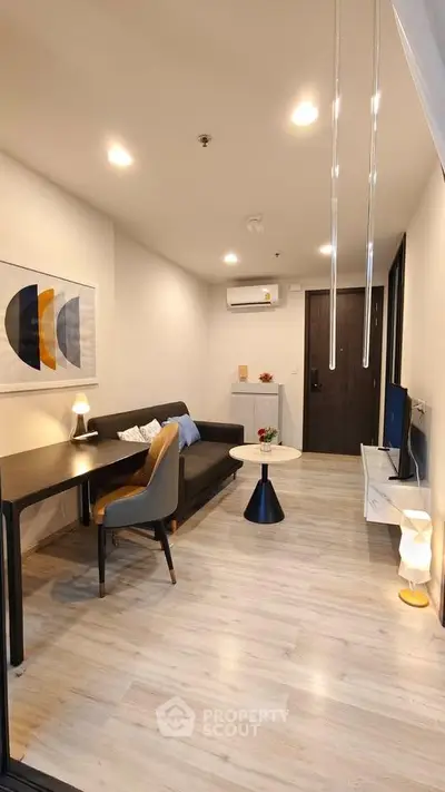Modern living room with stylish decor, cozy seating, and ambient lighting in a contemporary apartment.
