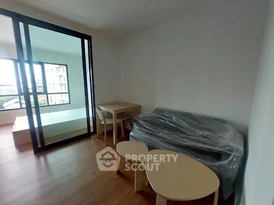 Modern apartment interior with wooden flooring and minimalist furniture