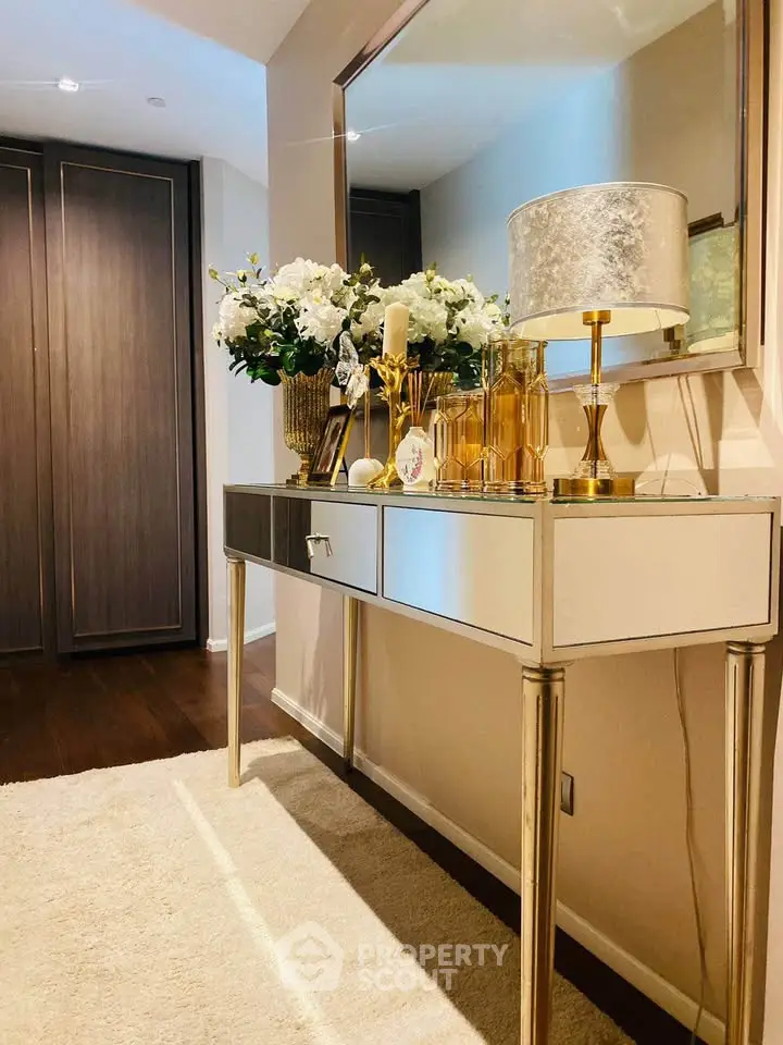 Elegant hallway with stylish console table and decorative accents in modern apartment.