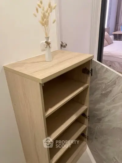 Modern wooden storage cabinet in a stylish bedroom setting