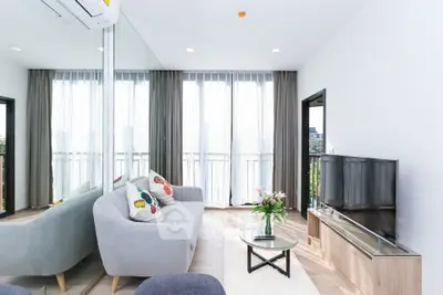 Modern living room with large windows and stylish decor