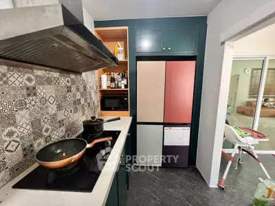 Modern kitchen with stylish backsplash and sleek appliances