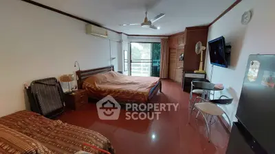 Spacious bedroom with balcony access and modern amenities