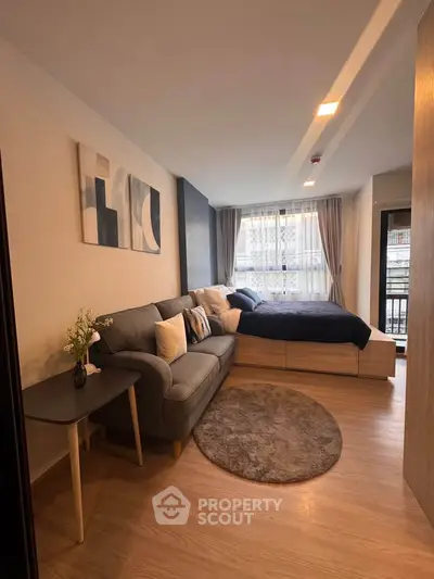 Modern studio apartment with cozy living area and stylish decor