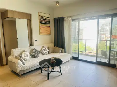 Modern living room with cozy sofa and city view balcony in luxury apartment