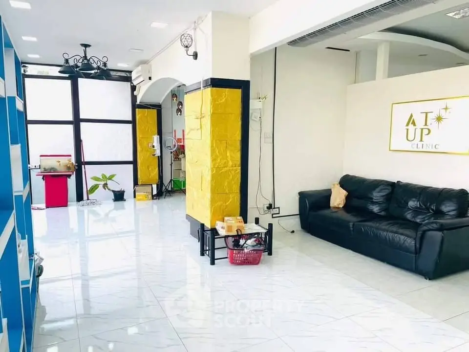 Spacious modern clinic interior with sleek design and comfortable seating area.